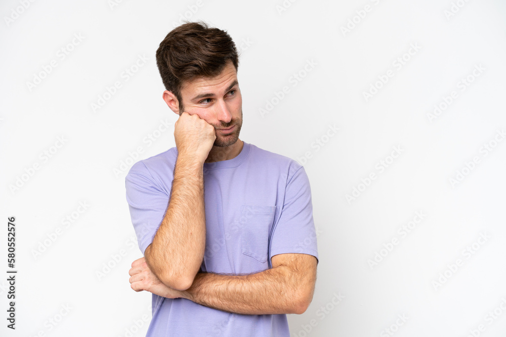 Young caucasian man isolated on white background with tired and bored expression Young caucasian man isolated on white background with tired and bored expression
