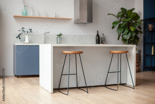 Modern kitchen interior in scandinavian style and gray tones. Kitchen island and bar stool. Horizontal. 