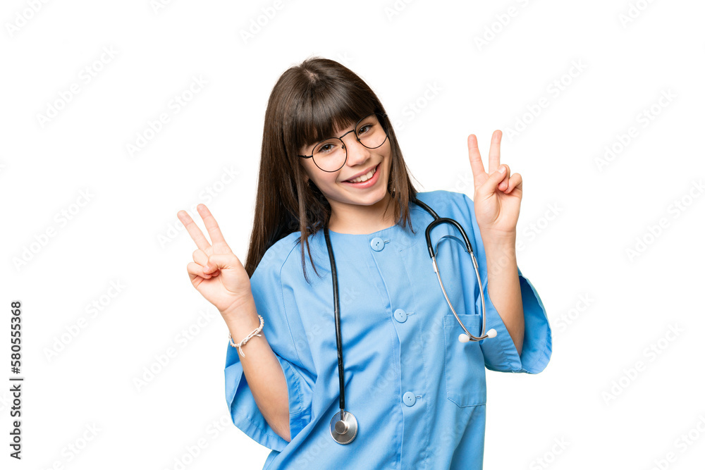 Little girl as a surgeon doctor over isolated chroma key background showing victory sign with both hands Little girl as a surgeon doctor over isolated chroma key background showing victory sign with both hands