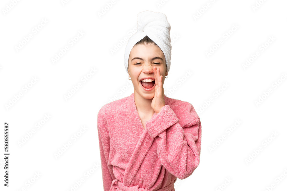 Little girl in a bathrobe over isolated chroma key background shouting with mouth wide open Little girl in a bathrobe over isolated chroma key background shouting with mouth wide open