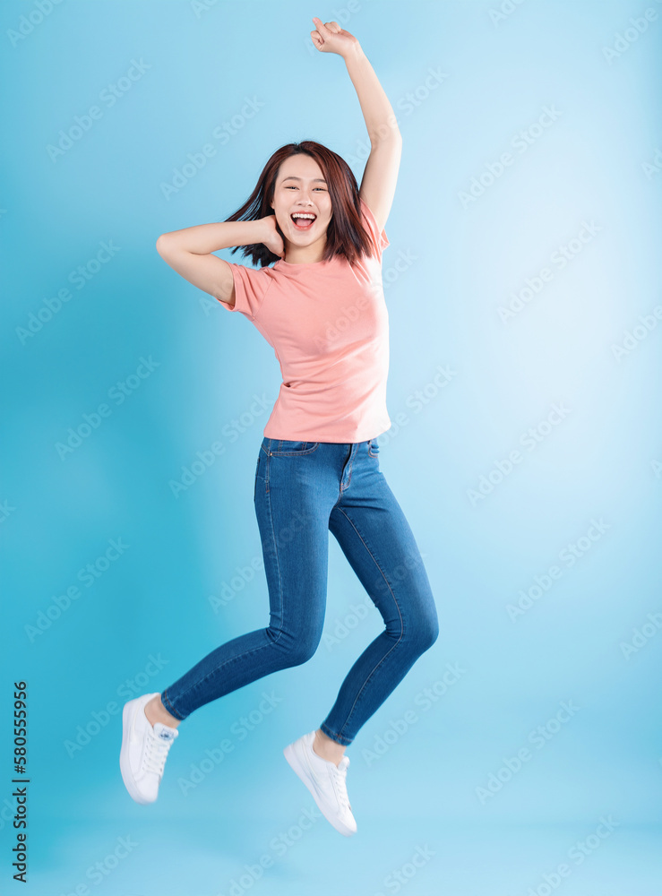 Fototapeta premium Asian woman on blue background