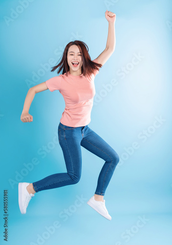 Asian woman on blue background © Timeimage