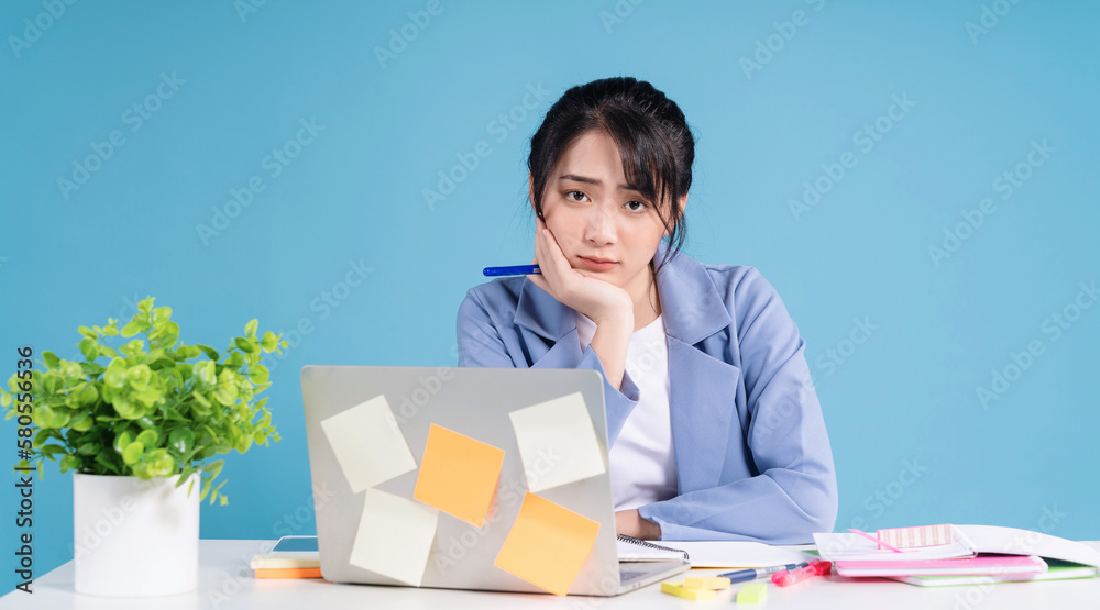 Young Asian businesswoman working on background Young Asian businesswoman working on background