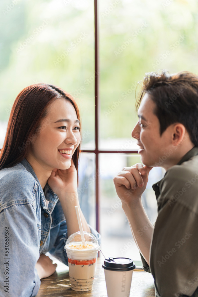 Young Asian couple dating at coffee shop Young Asian couple dating at coffee shop