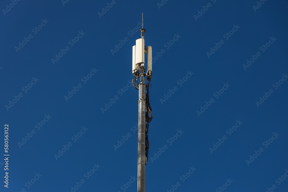 Close up of antenna repeater tower on blue sky Close up of antenna repeater tower on blue sky
