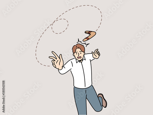 Frustrated man throw boomerang and element come back to him. Confused male employee suffer from effects of risky business. Boomerang effect. Vector illustration. 