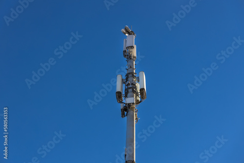 Close up of antenna repeater tower on blue sky