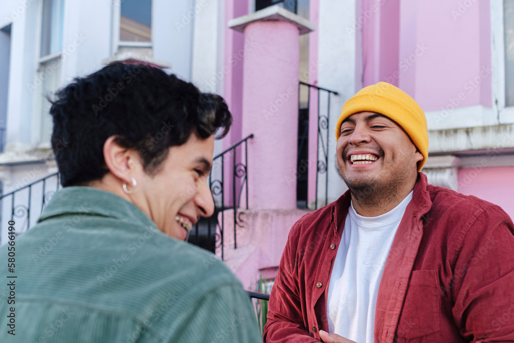 © Westend61 - Cheerful man having fun with brother in front of building © Westend61 - Cheerful man having fun with brother in front of building