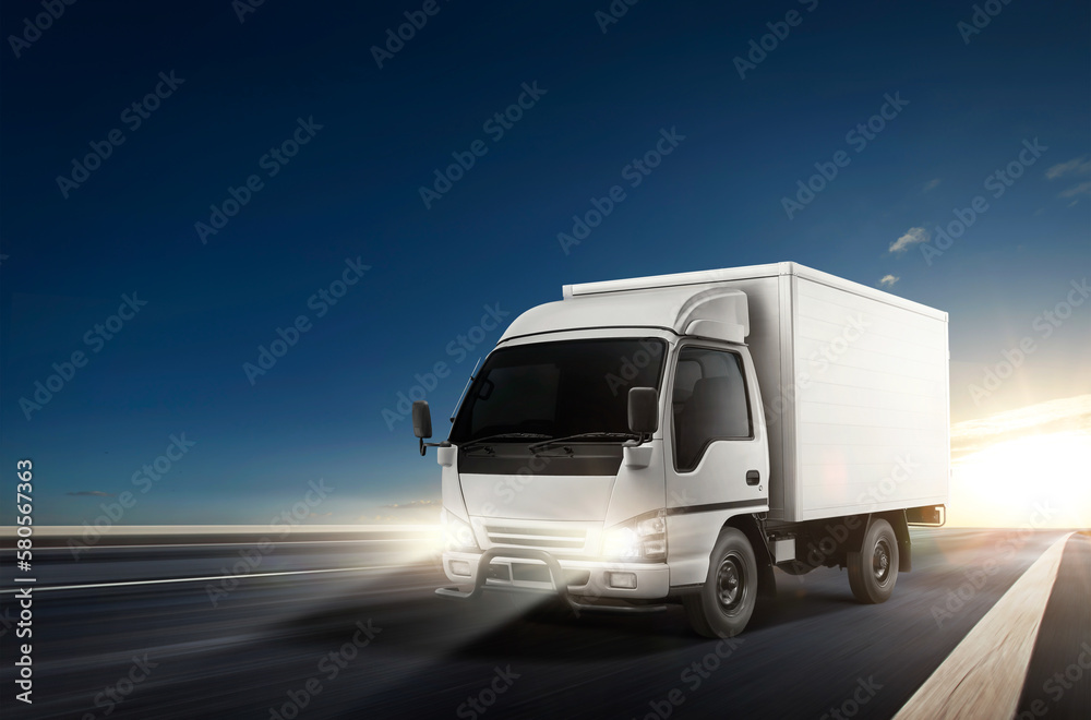 White truck driving on the speedway during sunset. Cargo logistic and freight shipping concept. 3D rendering.