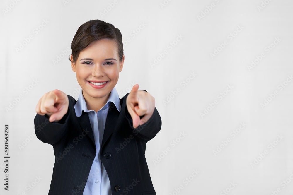 Beautiful young woman, pointing finger in camera Beautiful young woman, pointing finger in camera