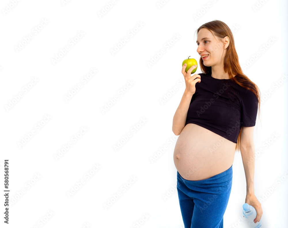 Pregnant woman propose apple for her belly copy space. Beautiful expectant lady having fresh snack, gray studio background. Healthy nutrition and pregnancy concept, copy space Pregnant woman propose apple for her belly copy space. Beautiful expectant lady having fresh snack, gray studio background. Healthy nutrition and pregnancy concept, copy space