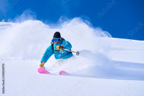 Mature man skiing on snow covered mountain photo