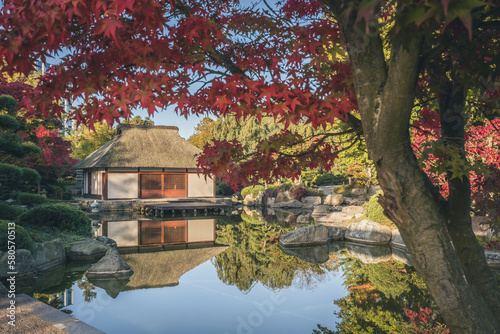 Germany, Hamburg, Pond and Japanese teahouse in Planten un Blomen park photo