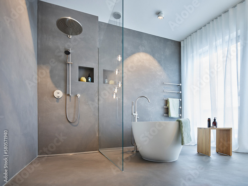 Bath tub and shower area in modern apartment photo