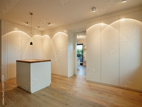 Illuminated dressing room in modern penthouse