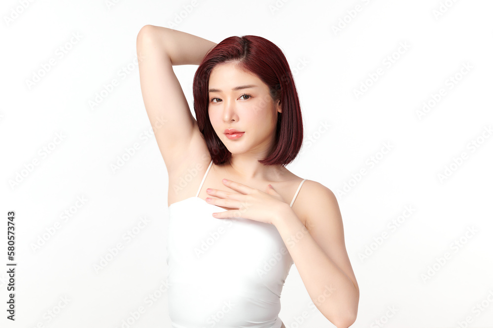 Beautiful Young Asian woman lifting hands up to show off clean and hygienic armpits or underarms on white background, Smooth armpit cleanliness and protection concept Beautiful Young Asian woman lifting hands up to show off clean and hygienic armpits or underarms on white background, Smooth armpit cleanliness and protection concept