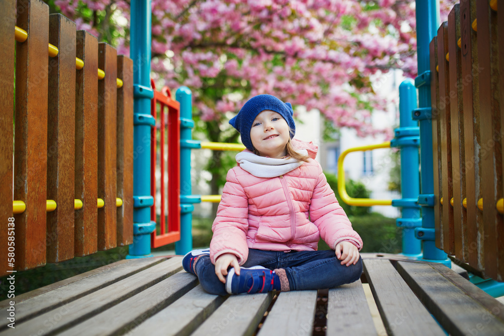 Happy 4 Years Old Girl Playing On A Playground In Paris France Stock happy-4-years-old-girl-playing-on-a-playground-in-paris-france-stock