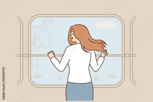 Smiling woman enjoy nature view from train window 