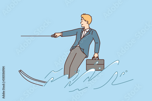 Businessman riding water ski