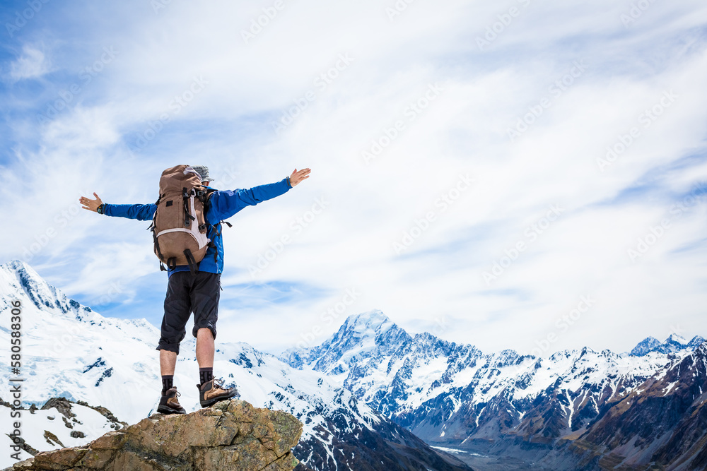 Hiker with backpack on the mountain top. Sport and active life concept Hiker with backpack on the mountain top. Sport and active life concept