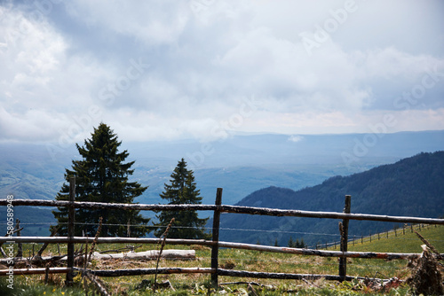 Mountain and hill landscape with clouds and fields. photo