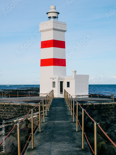 Main red and white lighthouse with bridge