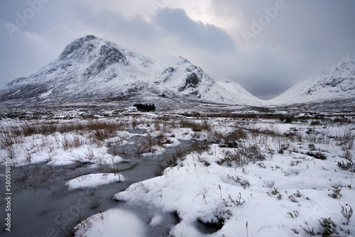 Buachaille Etive Mor covered in snow on a moody Winter day. Glencoe, Scotland, UK.