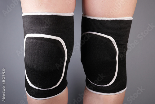 Woman in sports protective knee pads for team sports