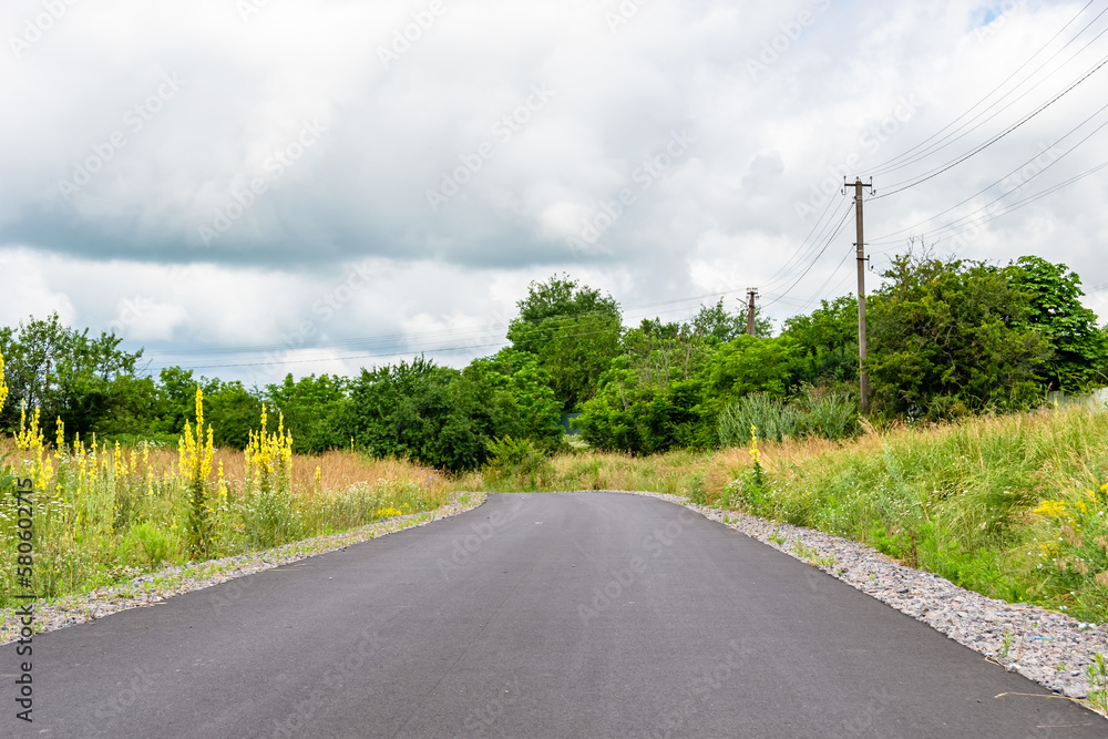 Beautiful empty asphalt road in countryside on colored background Beautiful empty asphalt road in countryside on colored background
