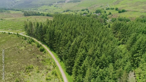 Glencree Ireland farmland and mountain road way with views of gorgeous green valley behind photo