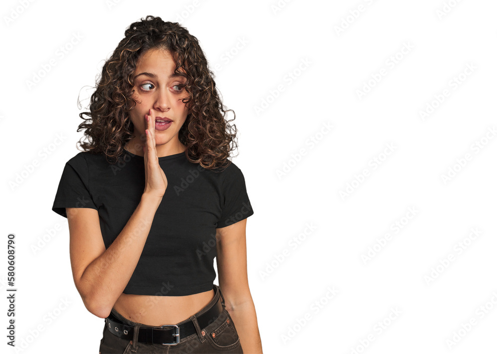Radiant young woman with stunning curls is saying a secret hot braking news and looking aside Radiant young woman with stunning curls is saying a secret hot braking news and looking aside
