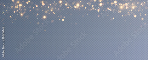 Golden sequins glow with many lights. Glittering dust. Luxurious background of golden particles.