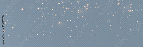 Golden sequins glow with many lights. Glittering dust. Luxurious background of golden particles.