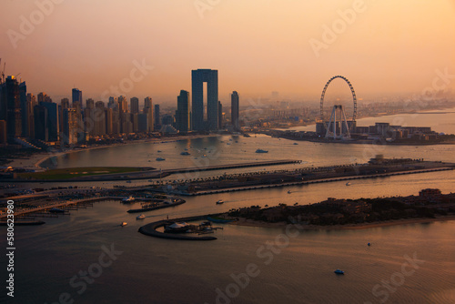 Dubai skyline on sunset, modern city with skyscrapers © Maresol