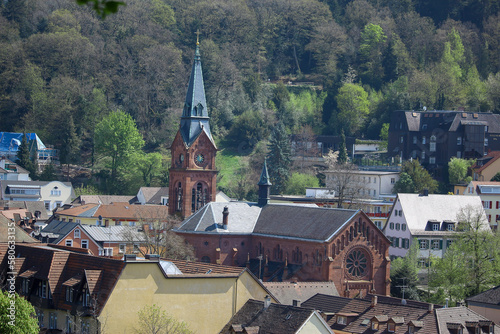 Distinct buildings and silhouettes shining against the golden sun in Badenweiler, Southern Germany, Europe near to the Black forest under the Easter sky in April