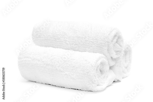 Rolled up spa towels. Folded soft terry towels isolated on white background. Three clean white towel.