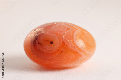 Carnelian or  cornelian is an orange-red variety of  cryptocrystalline quartz, commonly used as a semi-precious gemstone, and known for its healing properties photo
