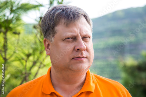 Portrait of a blond man 40-44 years old looking into the distance.