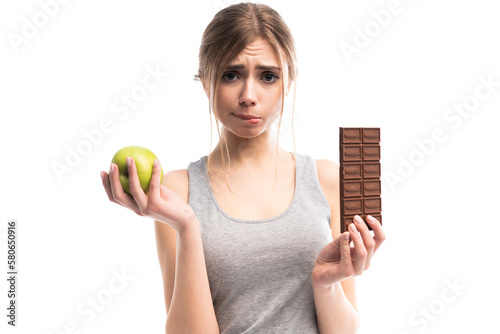 Diet. Dieting concept. Healthy Food. Beautiful Young Woman choosing between Healthy and Unhealthy Food.Fruits or Sweets. Isolated on a transparent Background