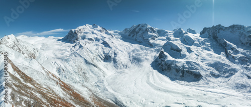 The Gorner Glacier Gornergletscher in Switzerland, second largest glacier in the Alps. Beautiful aerial panoramic view of the glacier. Eco global warming. photo