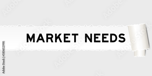 Ripped gray paper background that have word market needs under torn part