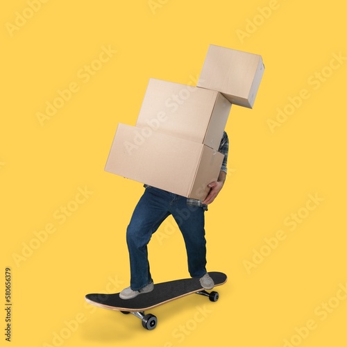 Young person with many big cardboard boxes