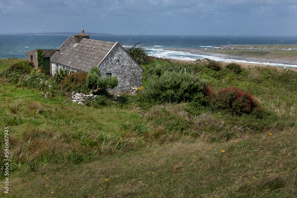 House at Cliffs of Moher. Westcoast Ireland. Clare county. Doolin and Liscannor. Bay of Galway. Ocean. House at Cliffs of Moher. Westcoast Ireland. Clare county. Doolin and Liscannor. Bay of Galway. Ocean.