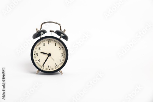 black vintage alarm clock isolated on white background, Time concept, 9:35 o'clock. Morning, reminder.