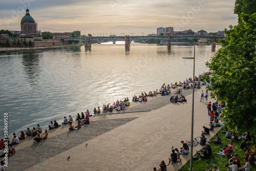 Wallpaper Mural Crowd of people gathering on the Quai de la Daurade by the Garonne river in Toulouse, after the lockdown on a beautiful spring evening Torontodigital.ca