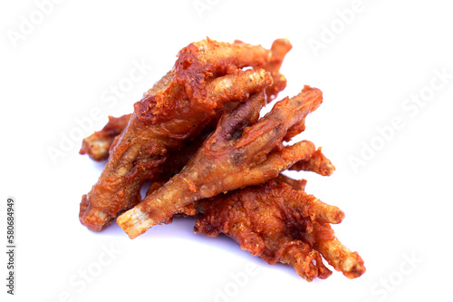 Fried crispy chicken feet isolated on white background. Concept, weird, exotic food. delicious and popular street food in Thailand     © Sanhanat