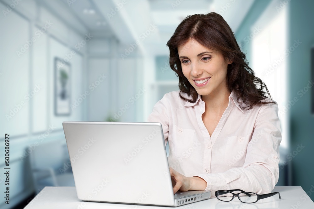 Happy young smart business woman with laptop Happy young smart business woman with laptop