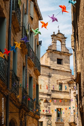 Wallpaper Mural Beautiful medieval house stone facade and colorful garland in the old town of Pezenas in the south of France (Herault) Torontodigital.ca