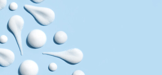 texture foam mousse foam cosmetic smear sample on blue background