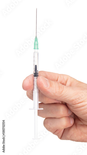 New syringe in adult hand on white background